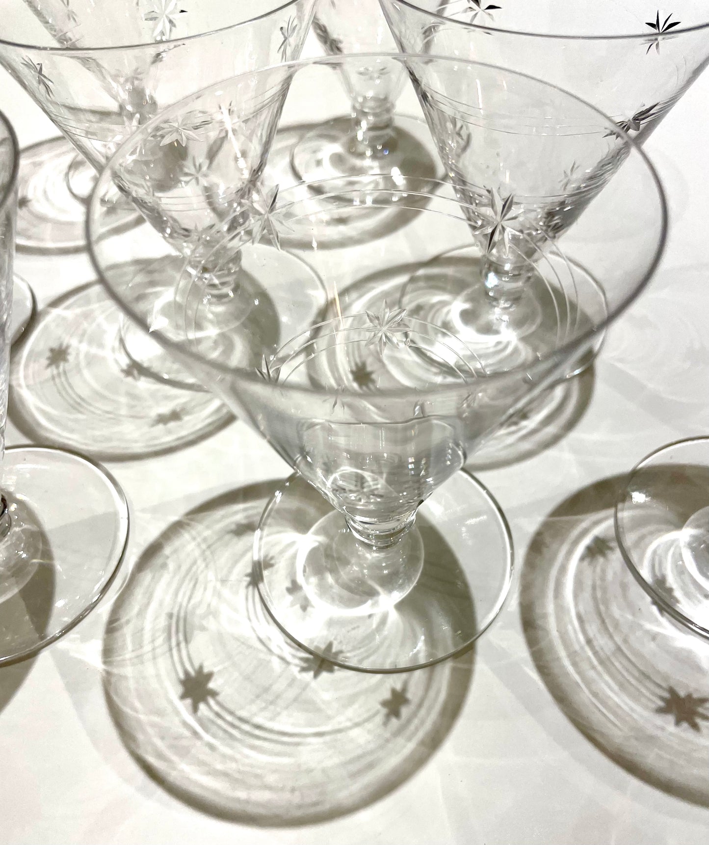 ✨ 10 Art Nouveau conical stemmed glasses with star pattern.